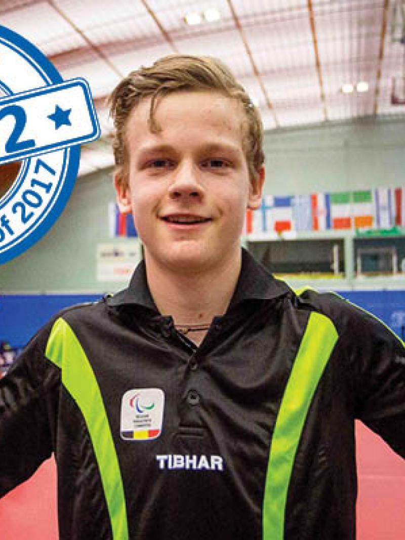 a male Para table tennis player gives a thumbs up to the camera