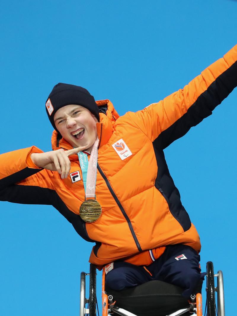 A male alpine skier on the podium