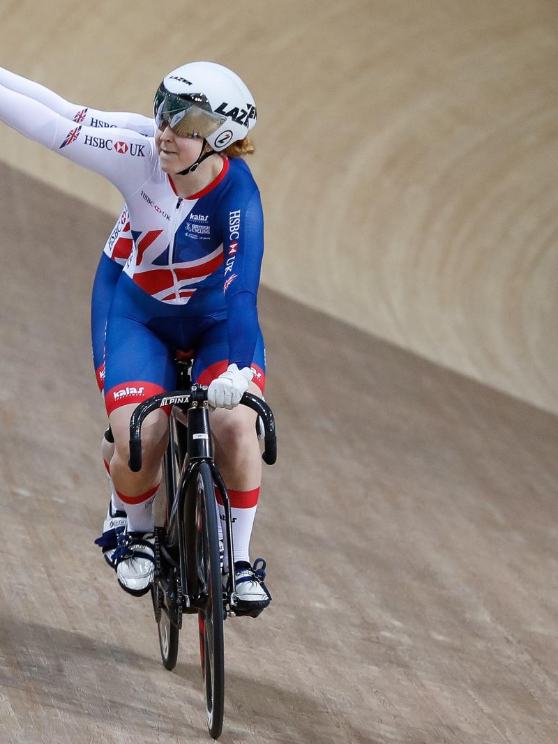 a female tandem team celebrate winning a race