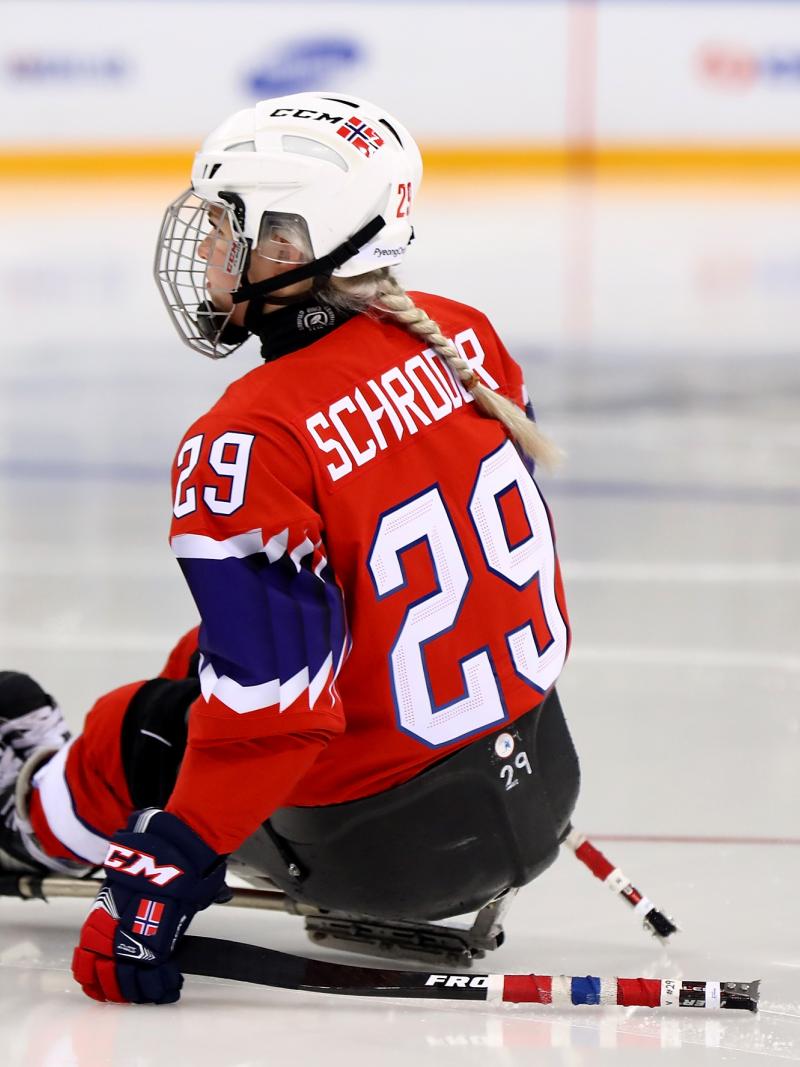 a female Para ice hockey player on the ice