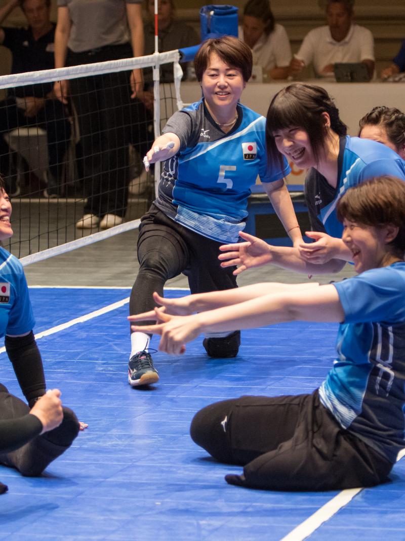 female Japanese sitting volleyball players play the ball