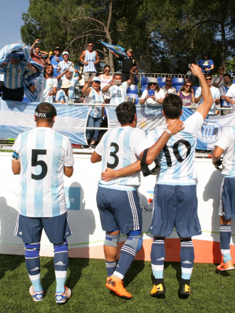 a group of Argentinian blind footballers dancing with their fans