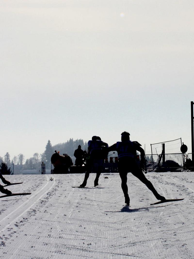 A group of cross-country skiers competing