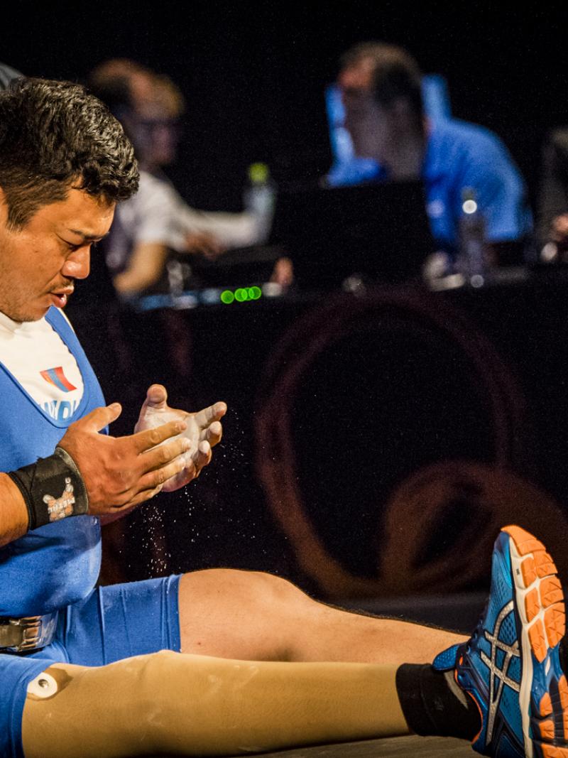 A man sat on a bench praying