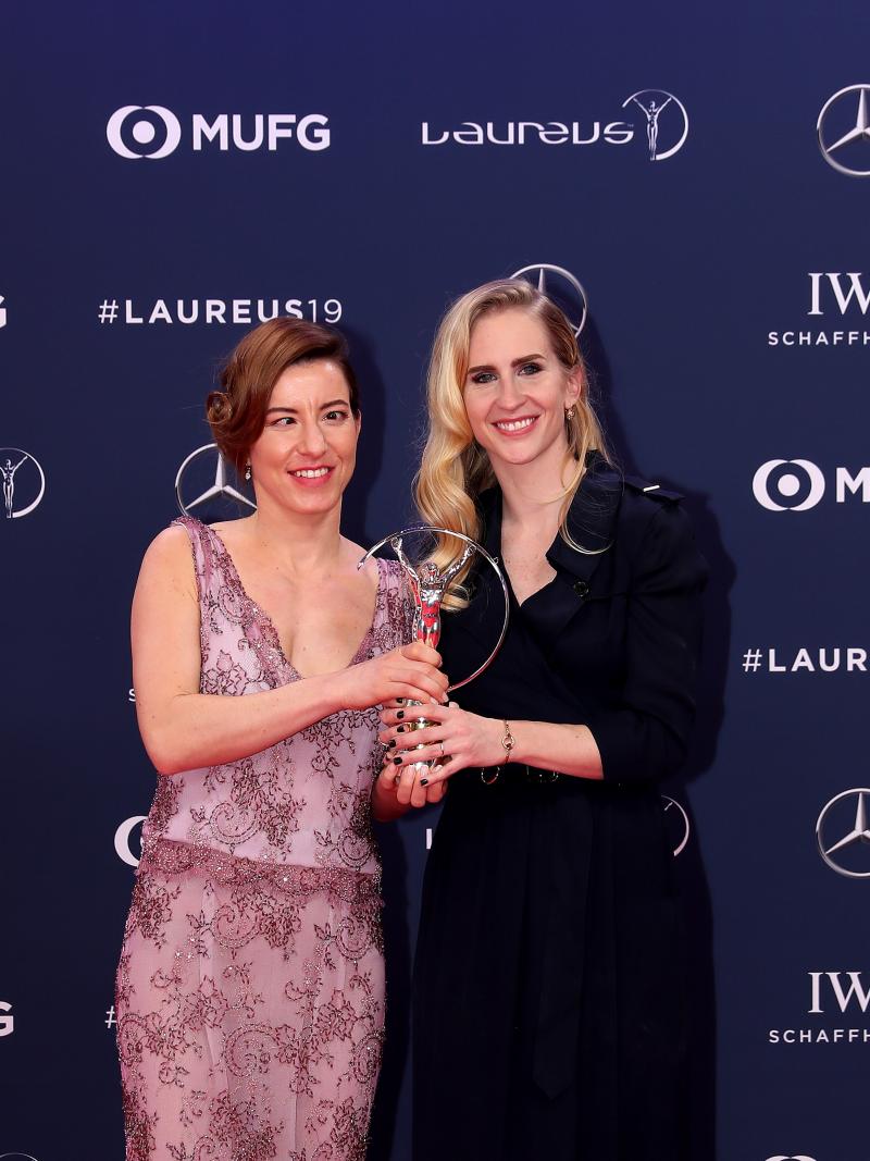 female Para alpine skier Henrieta Farkasova and guide Natalia Subrtova holding a silver Laureus trophy