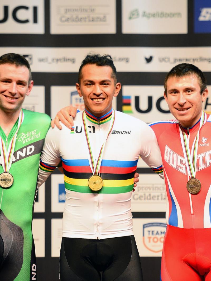 three male Para cyclists with Diego Duenas in the middle