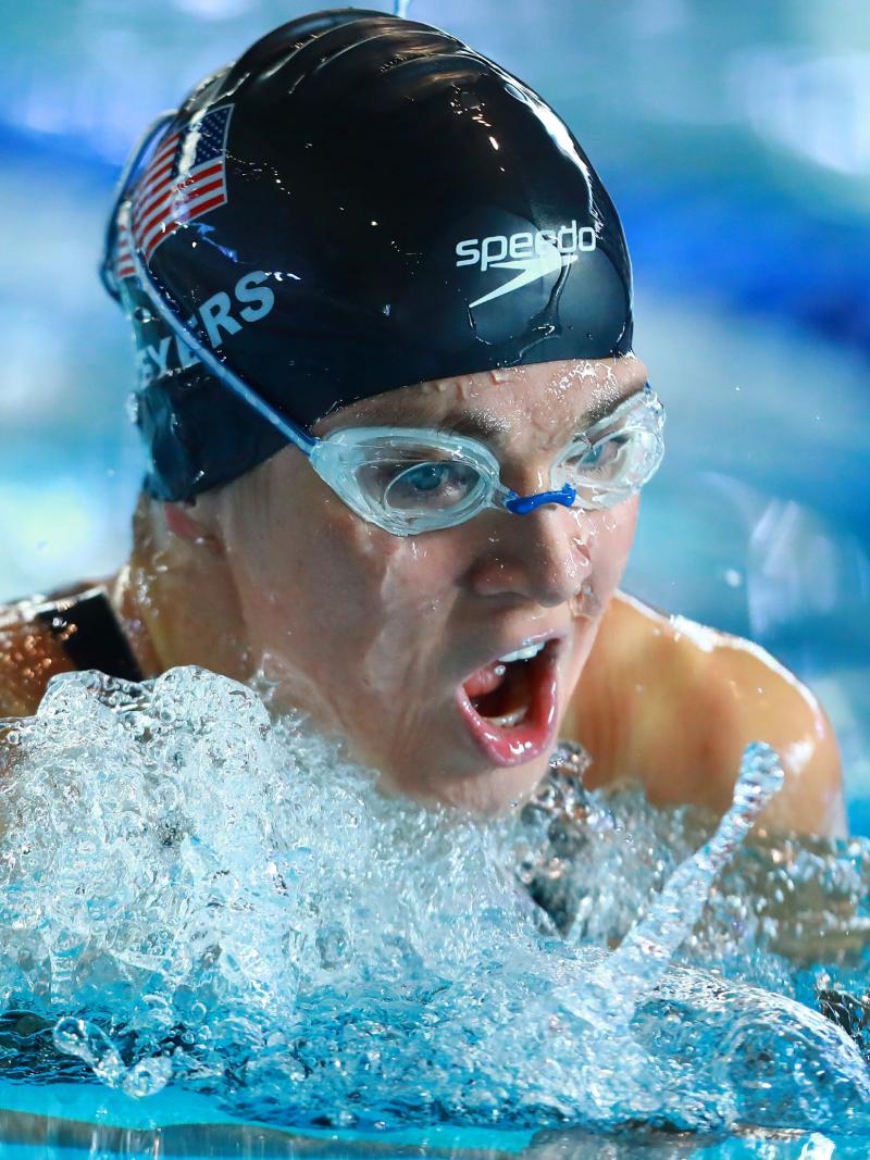 female Para swimmer Rebecca Meyers takes a breath mid-breaststroke