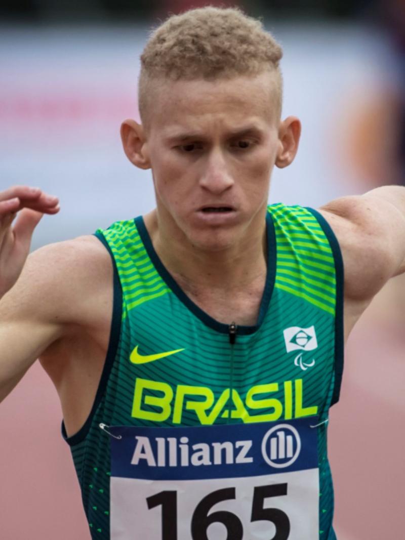 A man running on an athletics track
