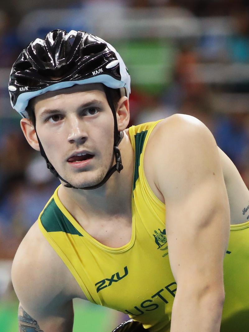 Rheed McCracken looks to the front after a race while wearing his Australian gear and helmet after the race