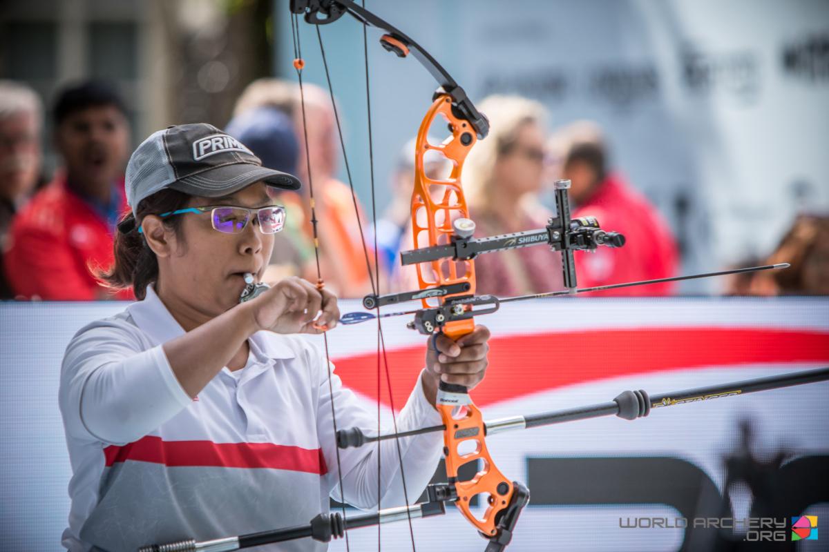 Signapore female archer prepares her bow and arrow