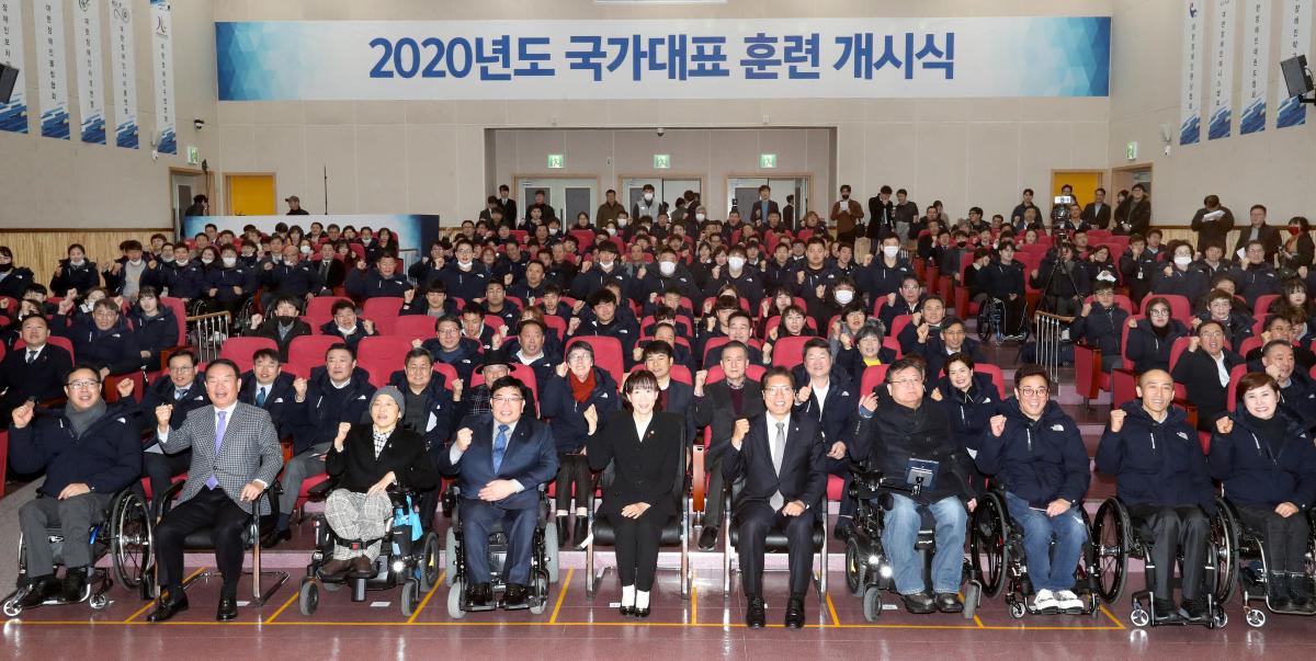 Group photo of athletes and staff at an initiation ceremony of a training centre