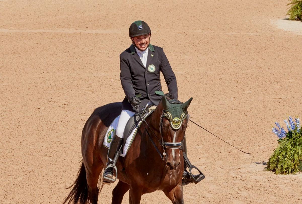 Saudia Arabian man riding a horse