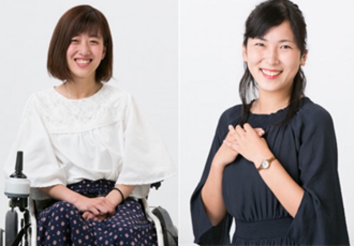 Two women posing, one of them in an electric wheelchair