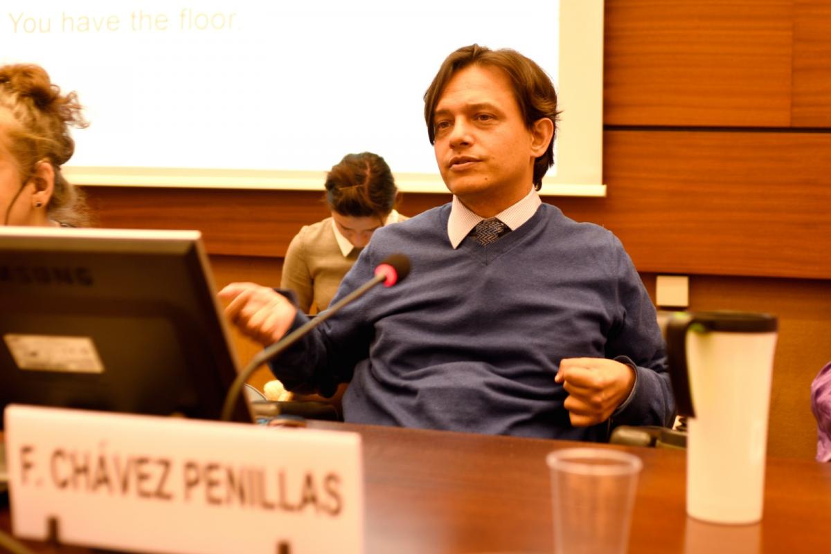 Man speaking at round table