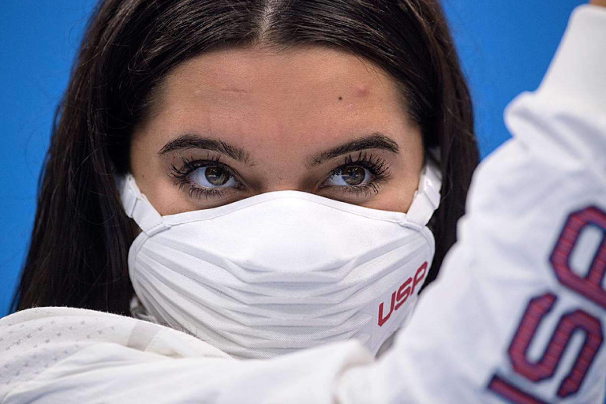 Close up of Anastasia Pagonis of USA brown eyes, brown hair and white USA mask