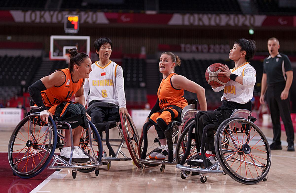 Chinese female basketball player prepares to shoot