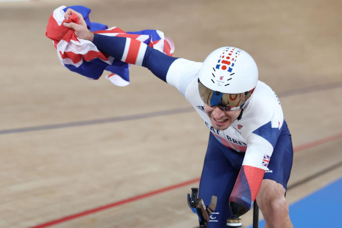 VICTORY LAP: Jaco van Gass of Great Britain celebrates after winning gold medal in the Track Cycling Men's C3 3000m Individual Pursuit race at Tokyo 2020 Paralympic Games. 