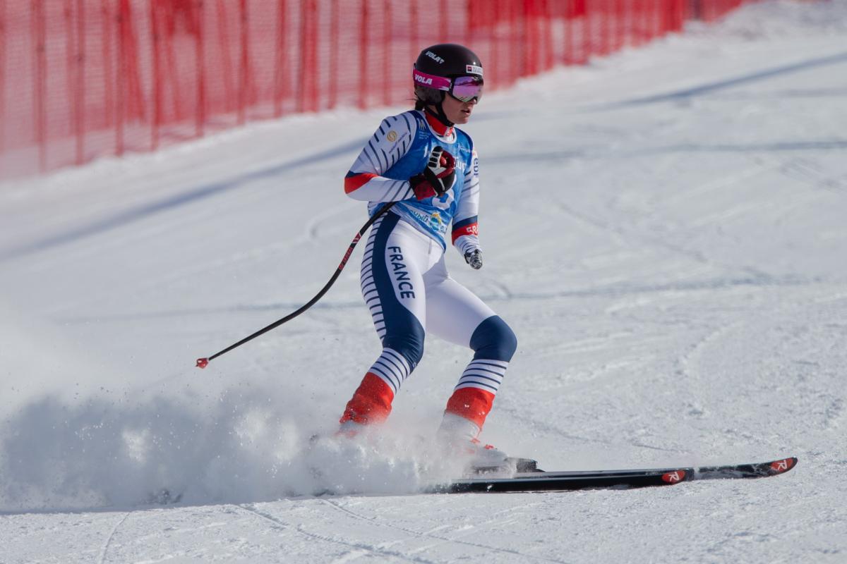 A female skier on a ski slope 