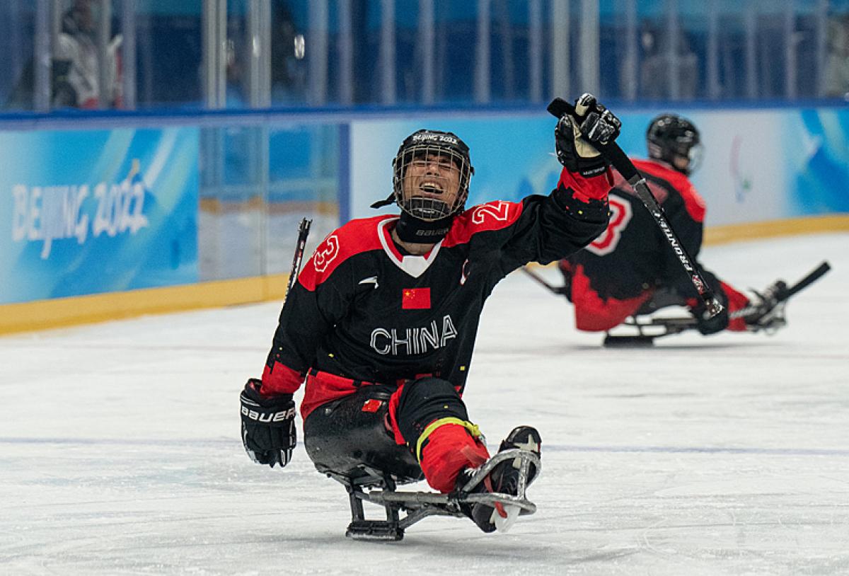 Chinese Para Ice Hockey player Cui Yutao celebrates after the victory against the Czech Republic