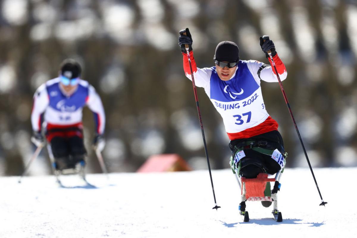 Zixu Liu of China competes in the men's sprint sitting Para Biathlon in the Beijing 2022 Paralympic Winter Games at Zhangjiakou National Biathlon Centre.