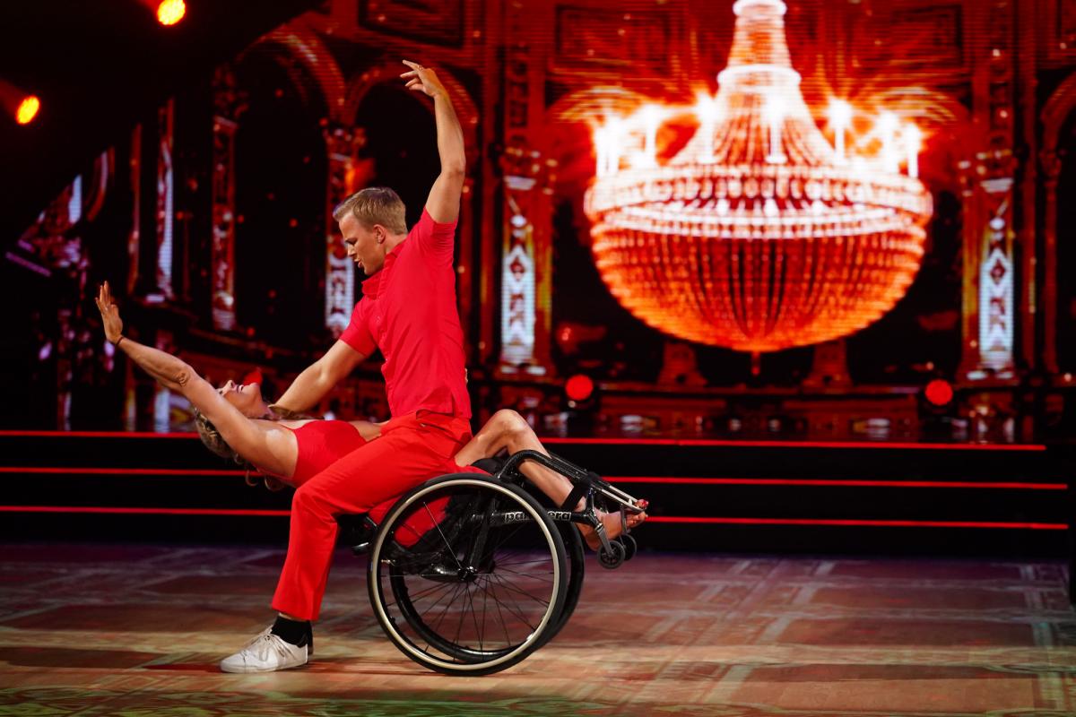 Philip Raabe leans over Birgit Skarstein, taking her and her wheelchair into a dip, as they perform a touching contemporary dance on Norway's SKal vi Danse.