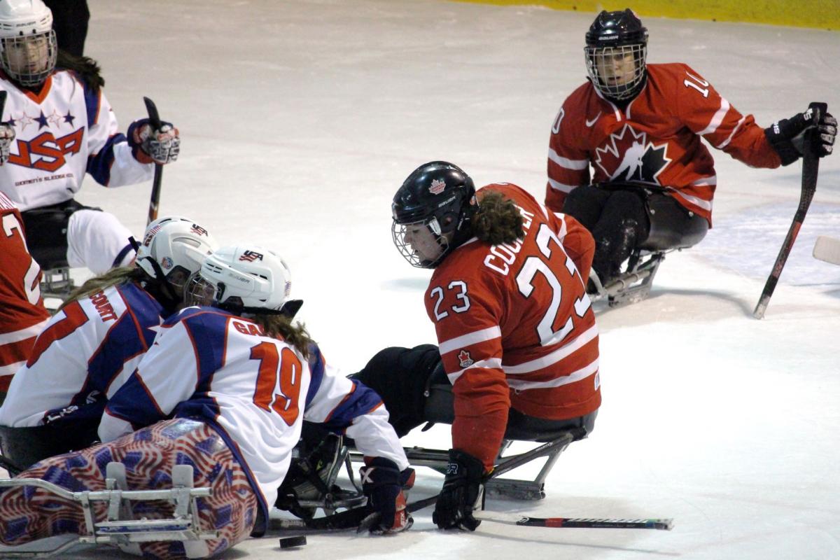 USA and Canadian players clash during a gold medal match in the second Women’s International Para Ice Hockey Cup held in Ostrava, Czech Republic.