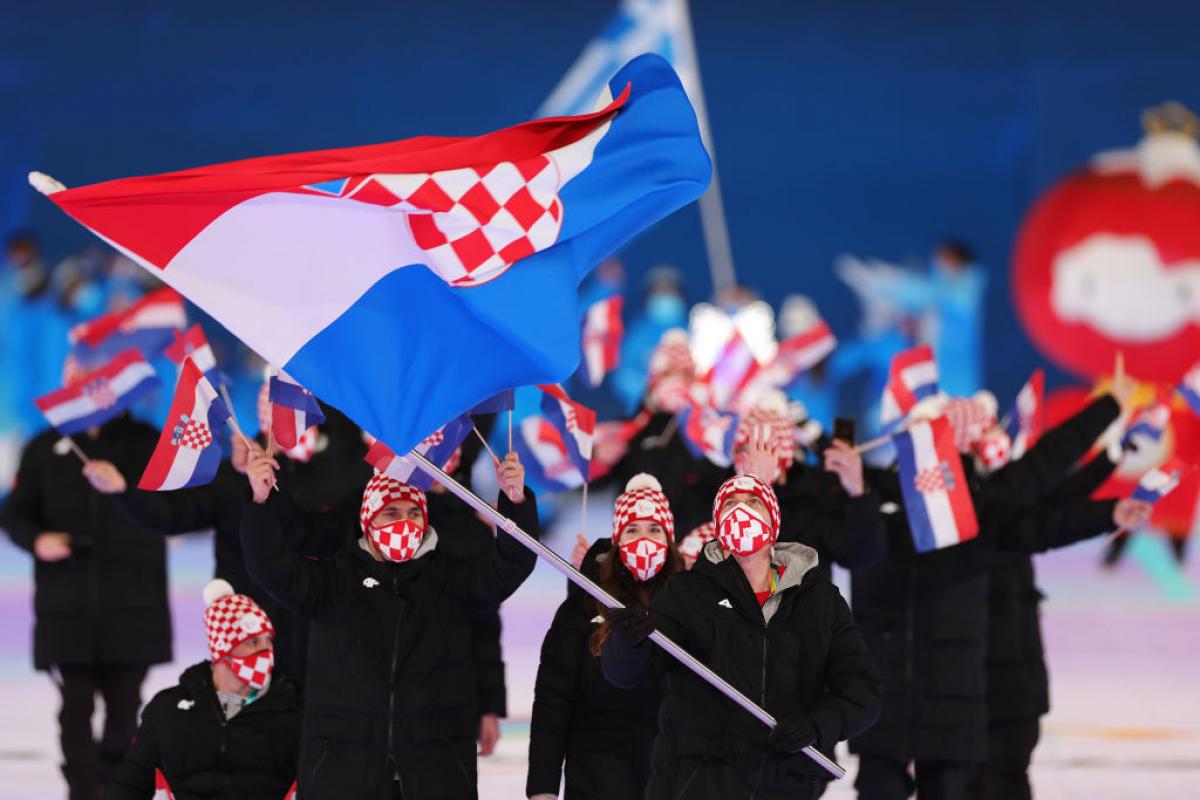 Croatian athletes march out in the athletes' parade at the Opening Ceremony of the Beijing 2022 Paralympic Games.