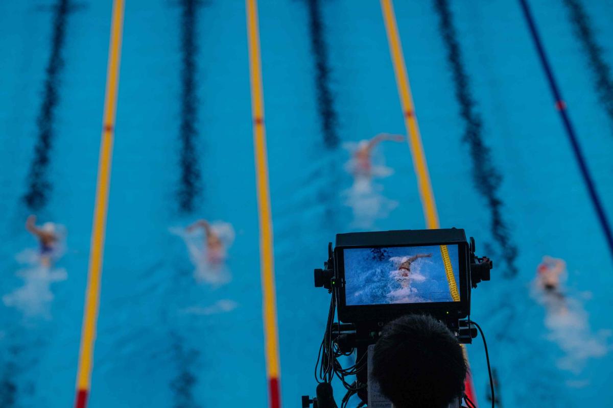 A camera showing a swimming competition