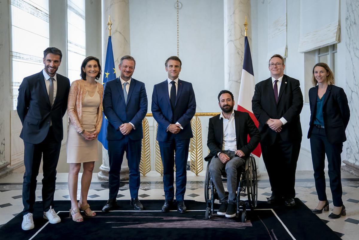 Seven people pose for a group photo