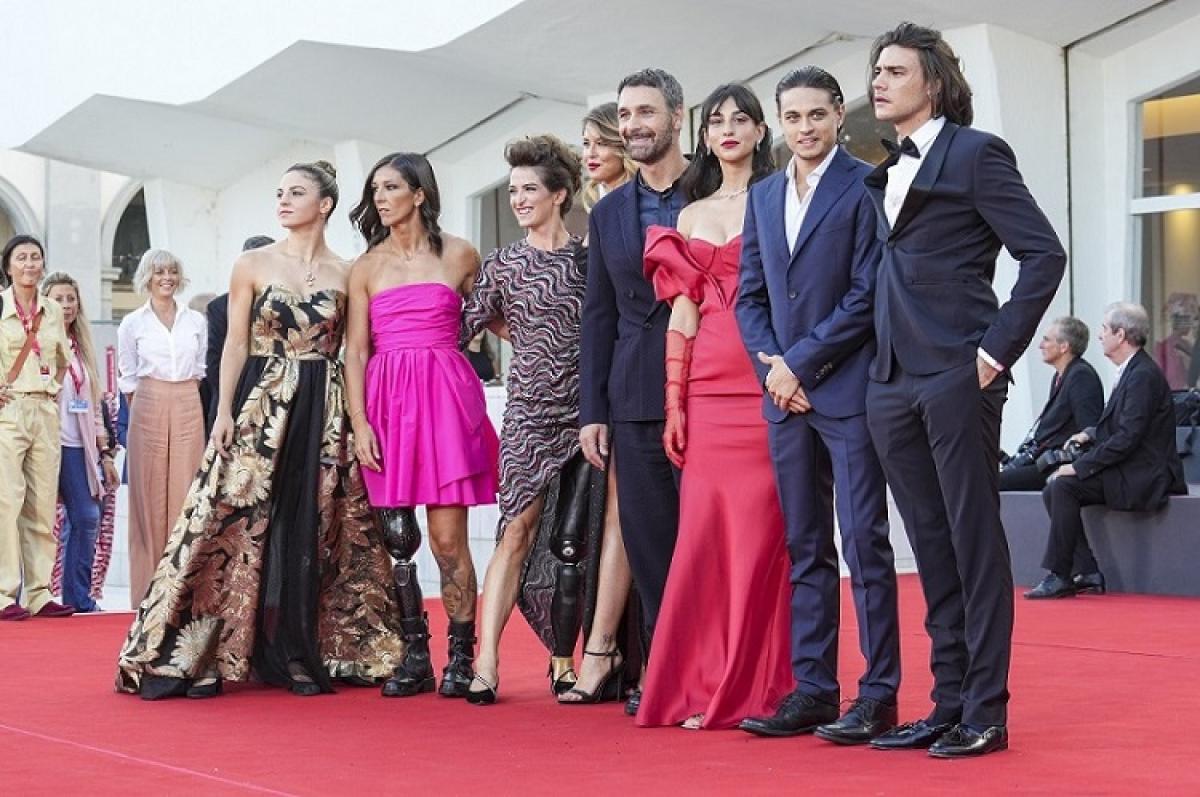 Italian Paralympians pose during the Red Carpet of the Venice Film Festival with the cast of Fantastici 5