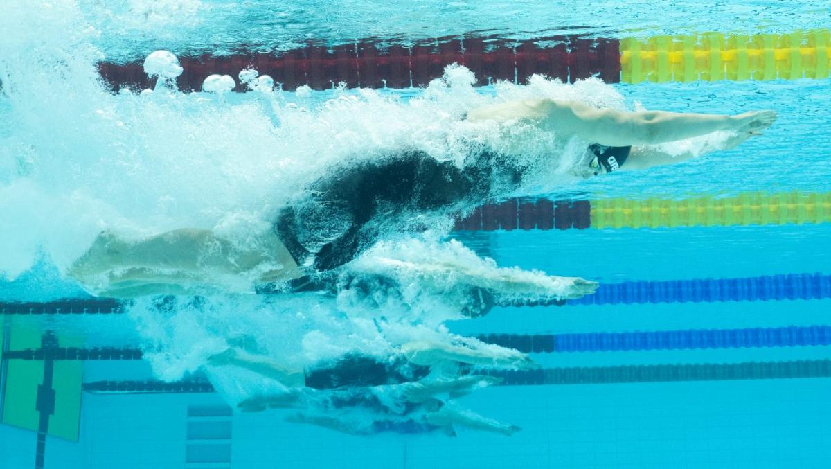 An underwater photo of five female swimmers in the water