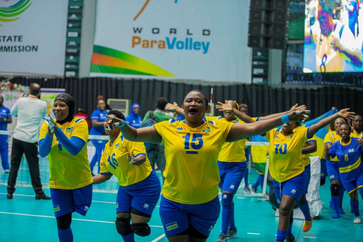 Female sitting volleyball athletes celebrating