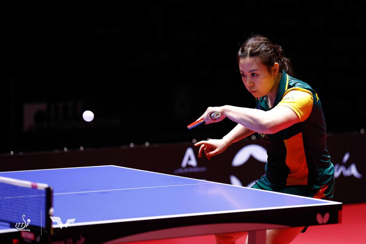 A female Para table tennis player in action.