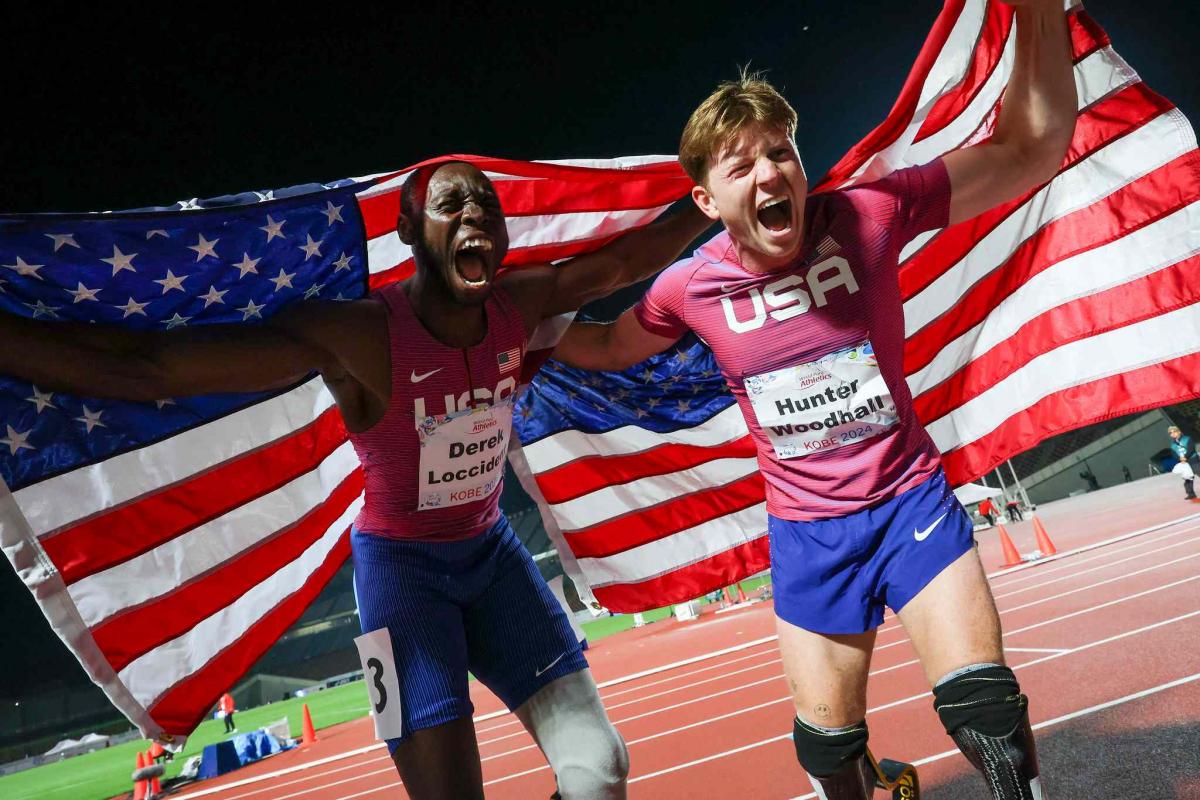 Athketes celebrate their medals 