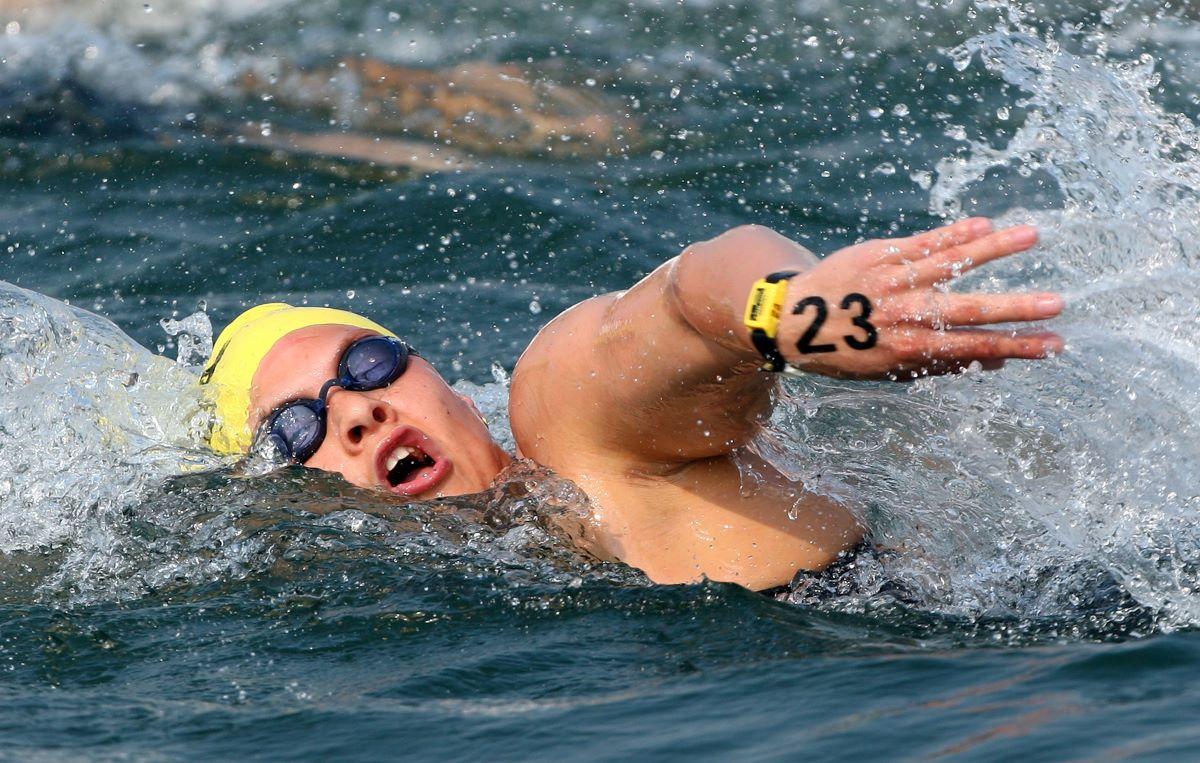 A female swimmer competing in an open water race