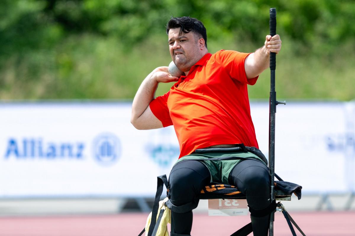 Salman Abbariki, a member of the Refugee Paralympic Team at Paris 2024, prepares to throw