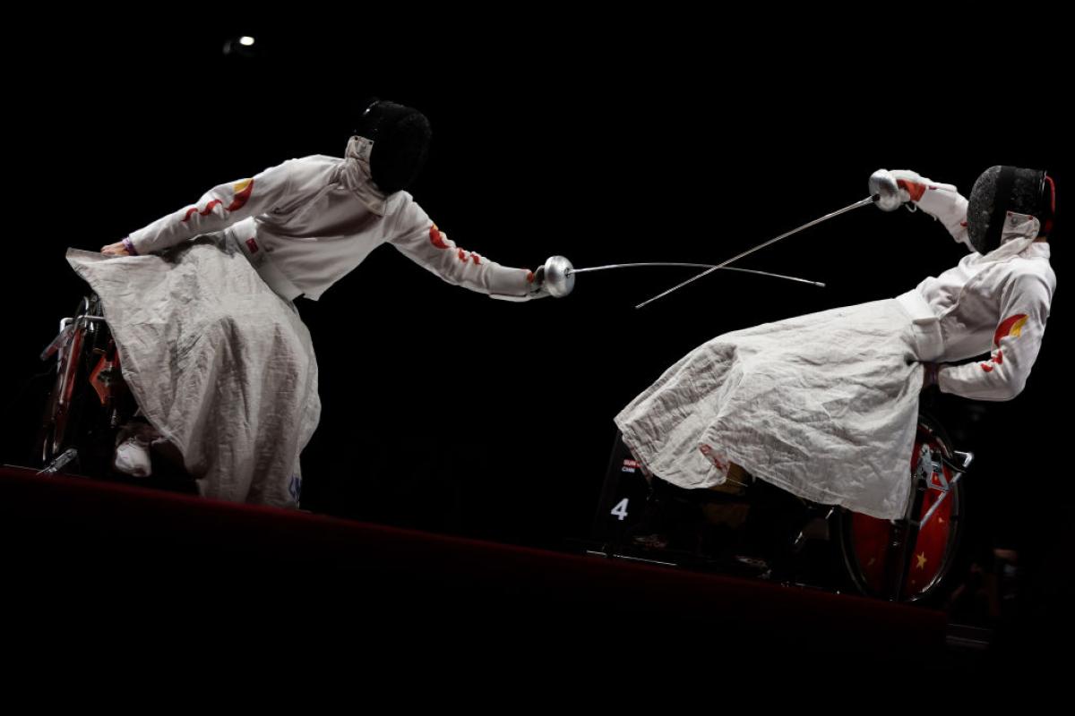 Two wheelchair fencers in action at the Tokyo 2020 Paralympic Games