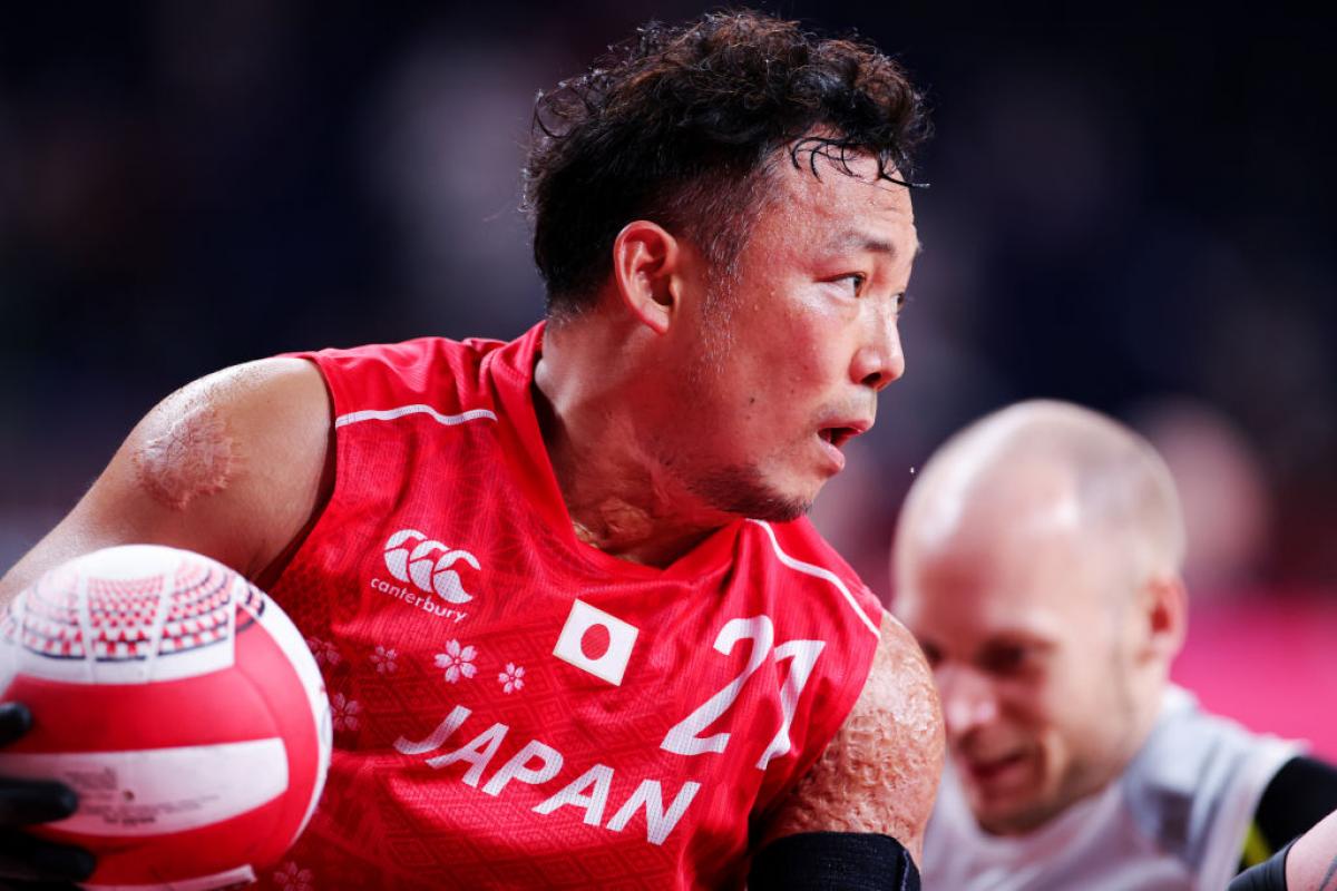 A close-up image of a male wheelchair rugby player