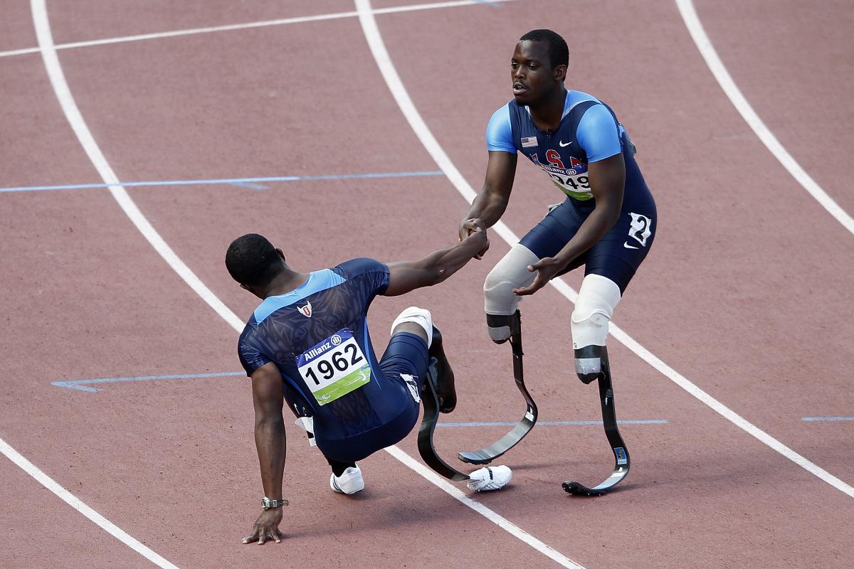 USA's Blake Leeper give teammate Jerome Singleton a helping hand USA's Blake Leeper give teammate Jerome Singleton a helping hand