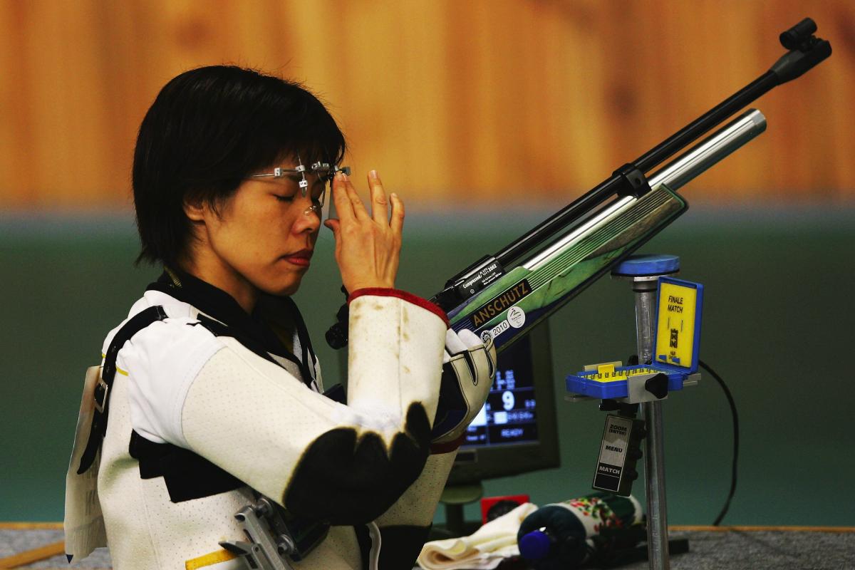 A picture of a girl holding a gun