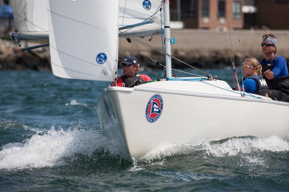 A picture of 3 person in a small boat