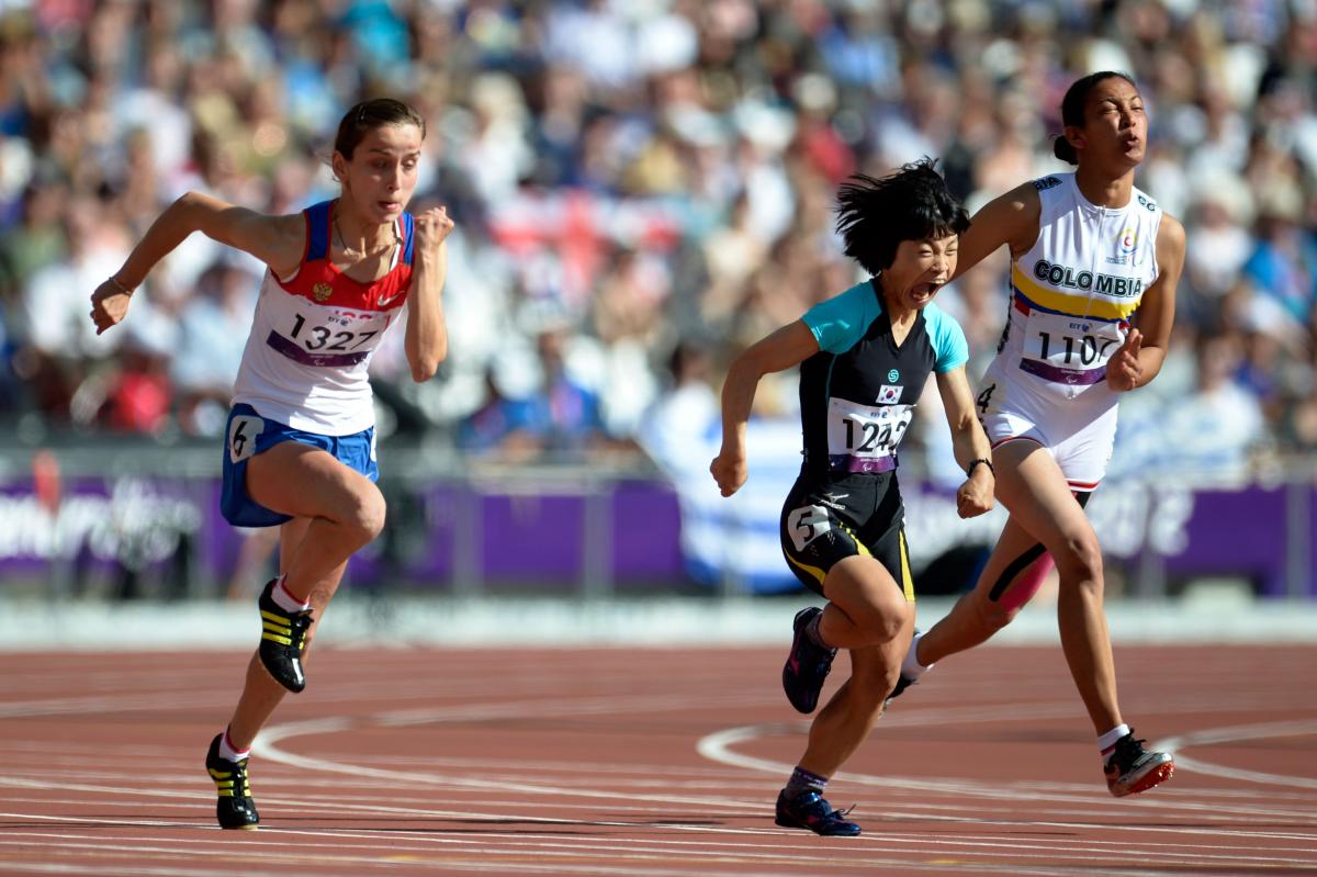 A picture of 3 women running in an athletics race