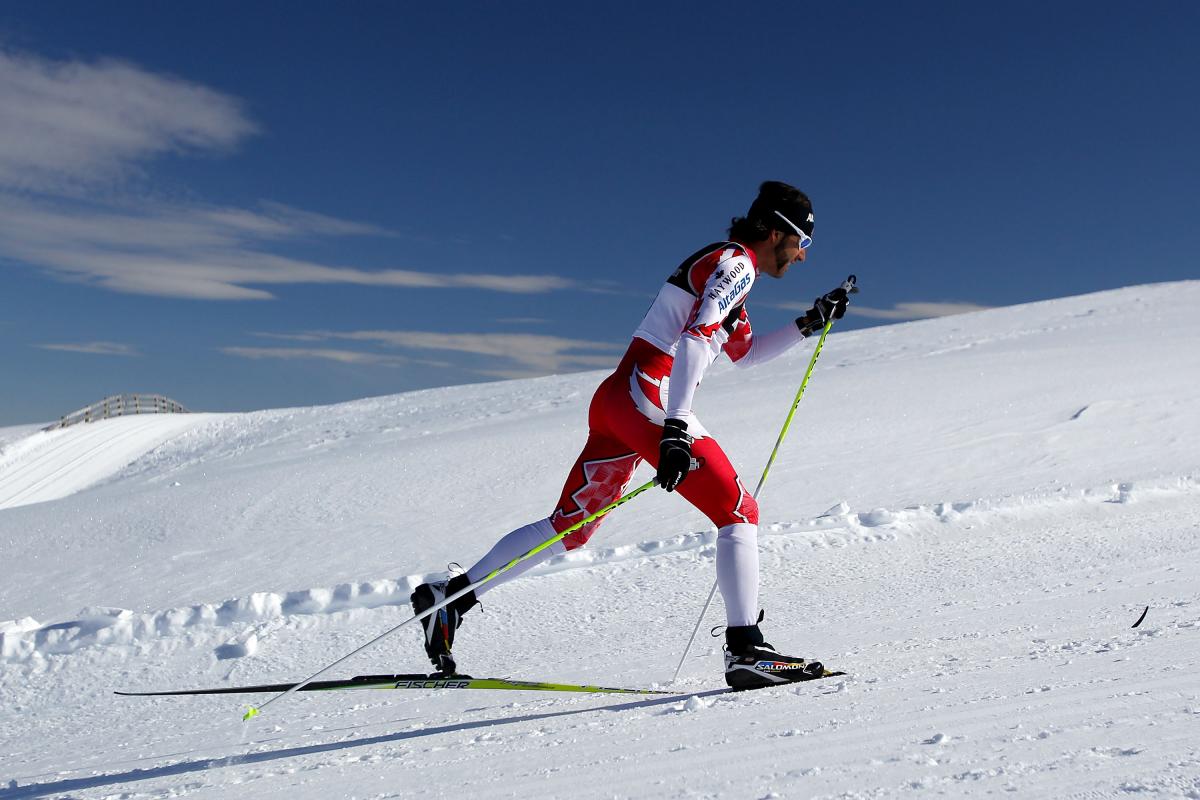 A picture of a man skiing a biathlon