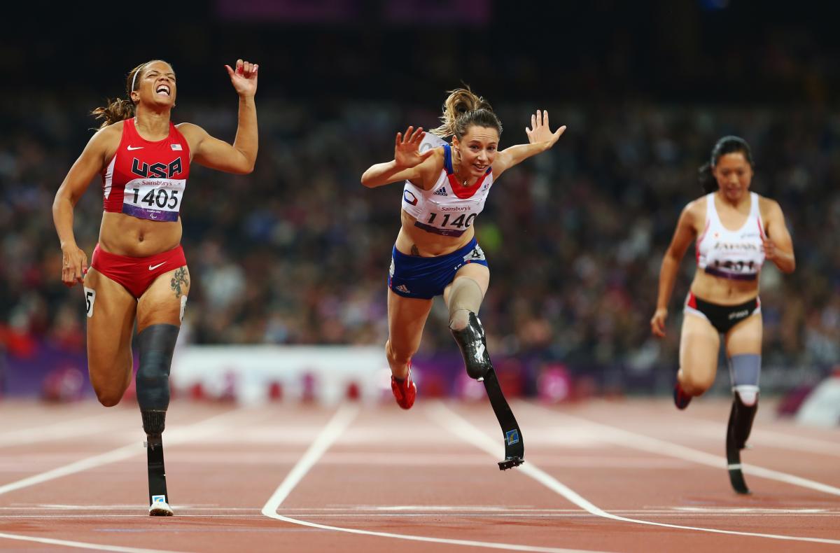 A picture of three women running on the track