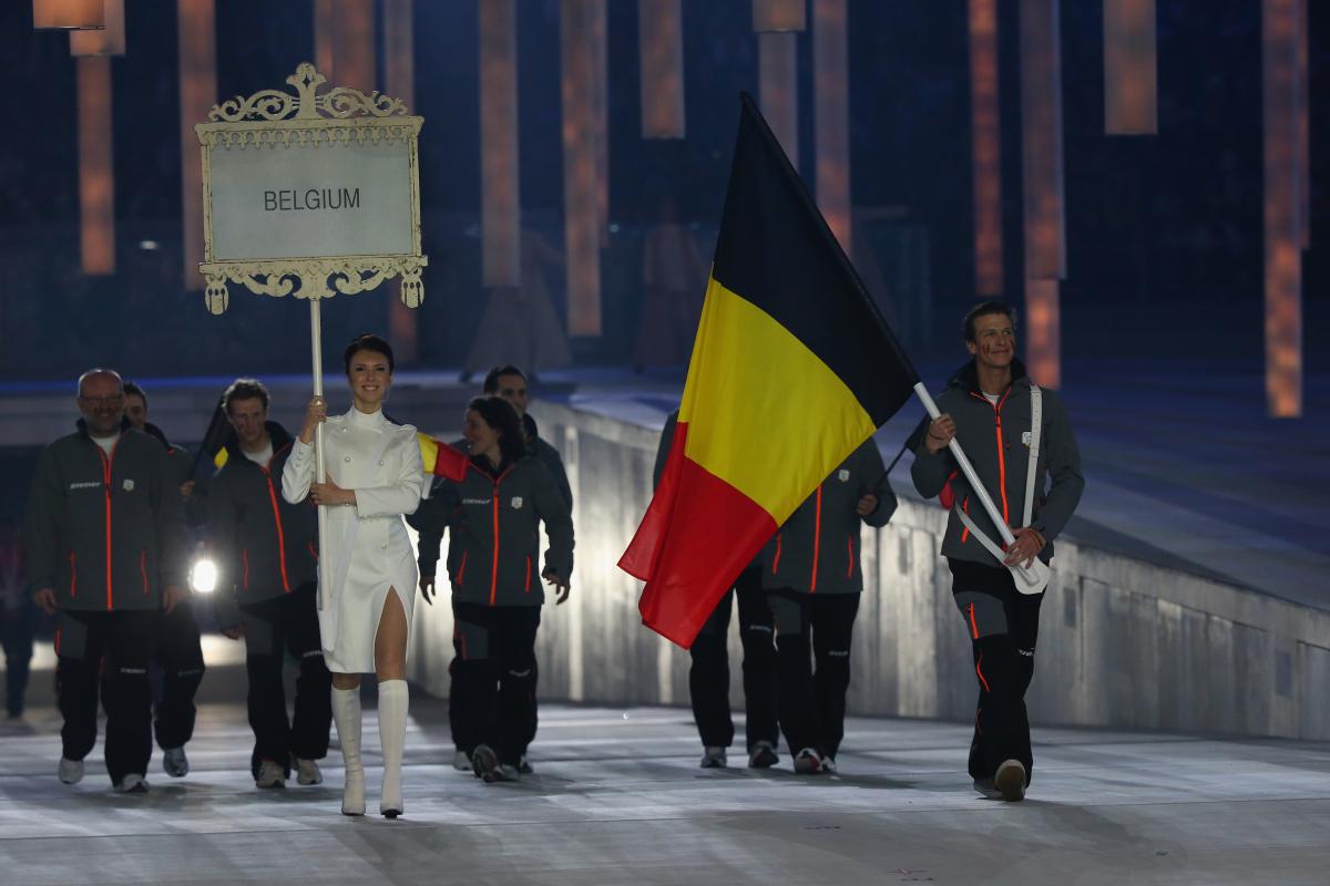 Belgium enter the arena lead by flag bearer Denis Colle during the Opening Ceremony of the Sochi 2014 Paralympic Winter Games