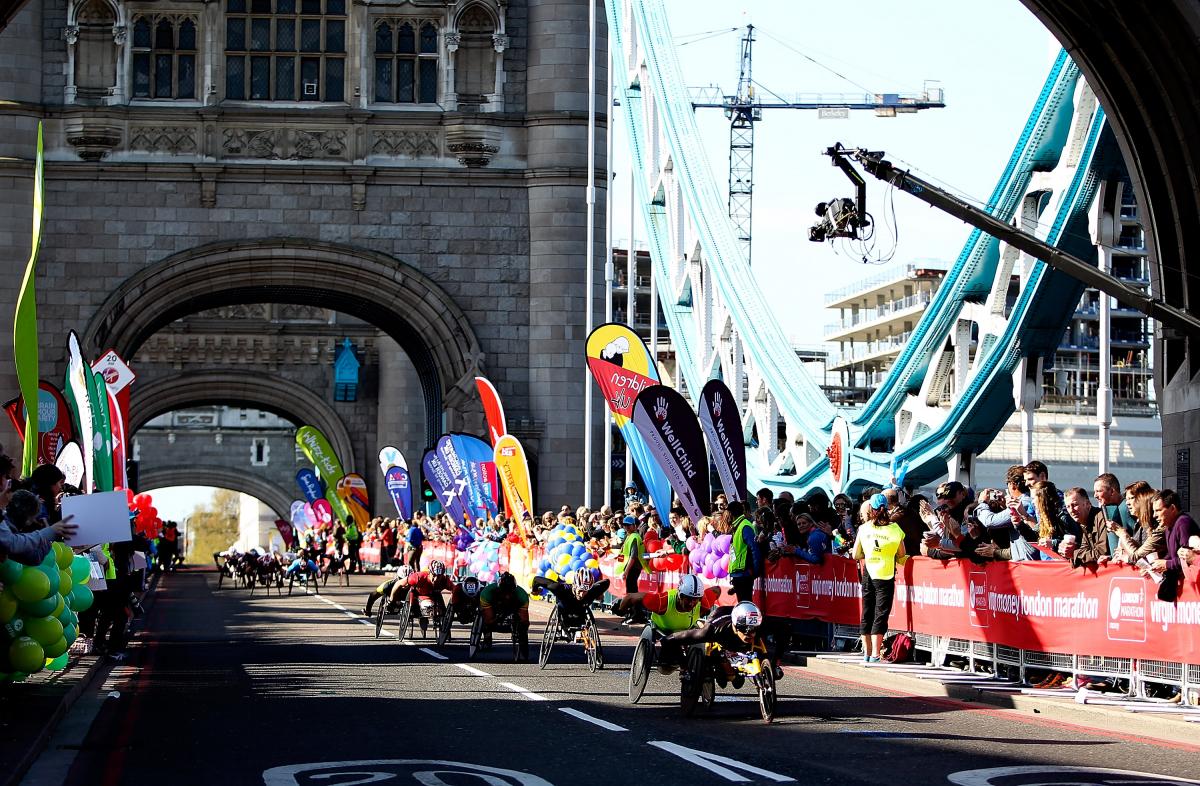 Men's wheelchair racers cross Tower Bridge in the 2014 Virgin Money London Marathon