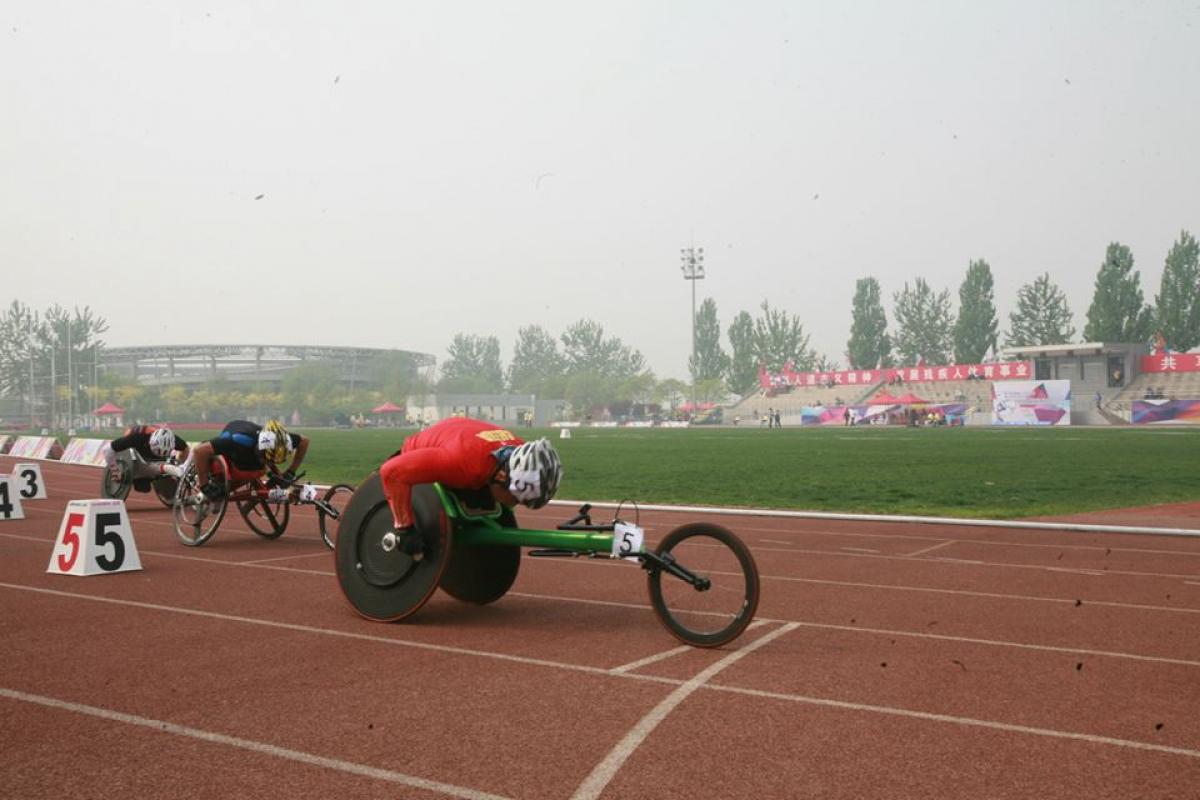 Athletes compete in a wheelchair race at the 2014 IPC Athletics Grand Prix in Beijing