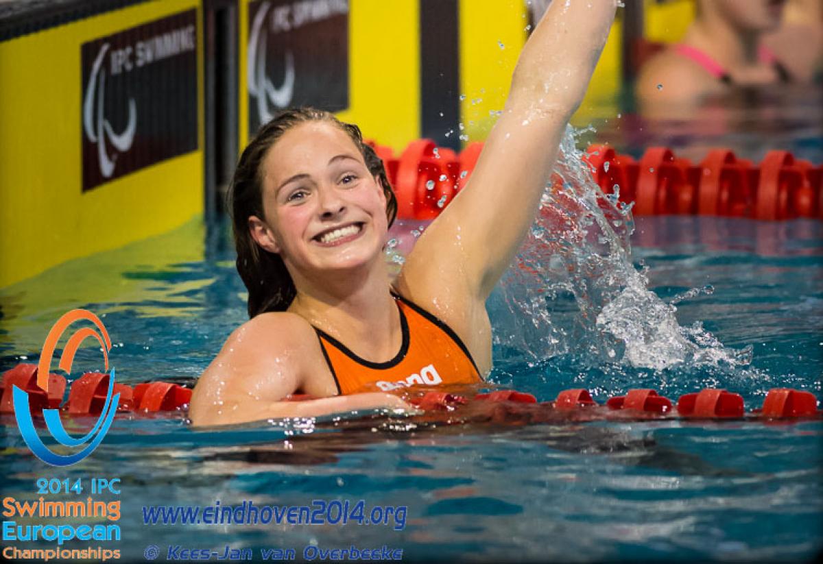 A Dutch swimmers celebrates winning gold at the 2014 IPC Swimming European Championships