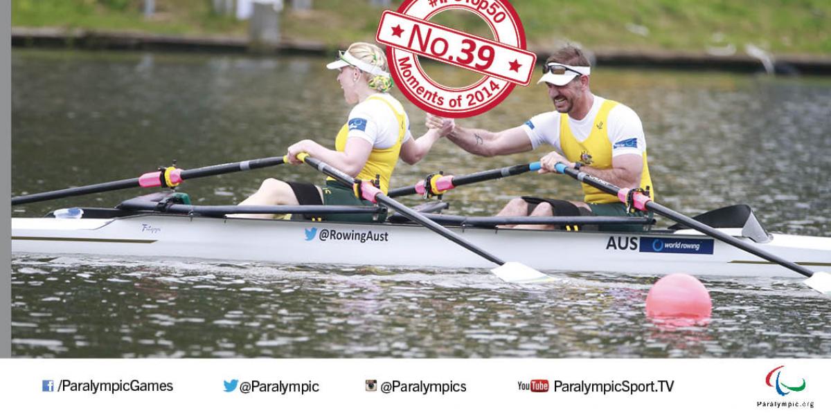 Kathryn Ross and Gavin Bellis hold hands in celebration in boat