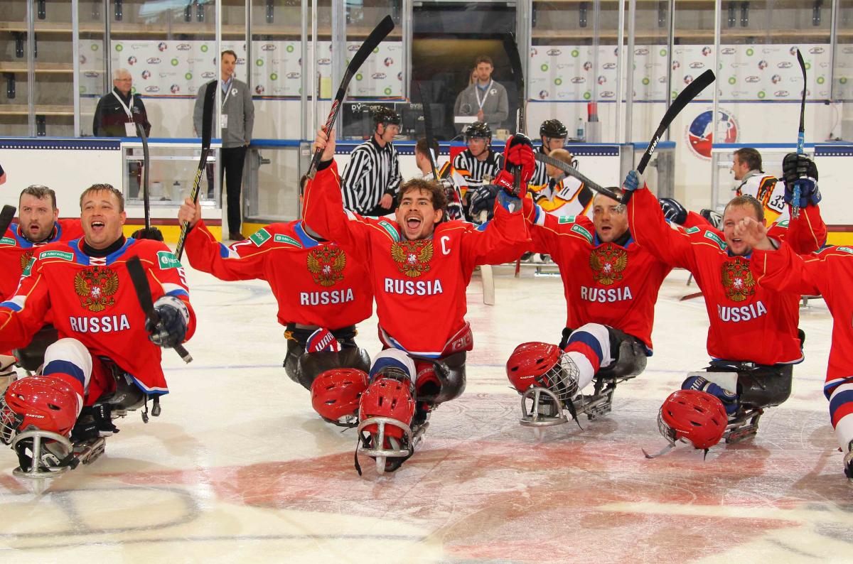 Russian captain Dmitrii Lisov celebrates with his teammates after defeating Germany at Buffalo 2015.